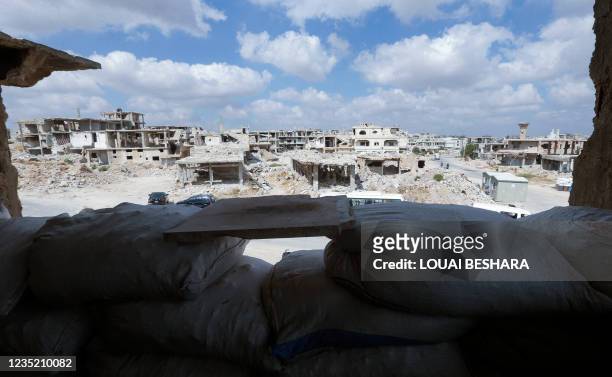 Picture taken during a tour organized by the Syrian Ministry of Information shows destruction in the district of Daraa al-Balad of Syria's southern...