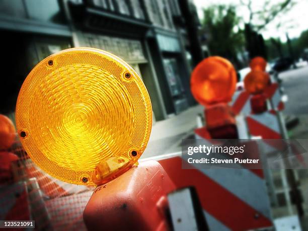 caution sign light - road works stock-fotos und bilder