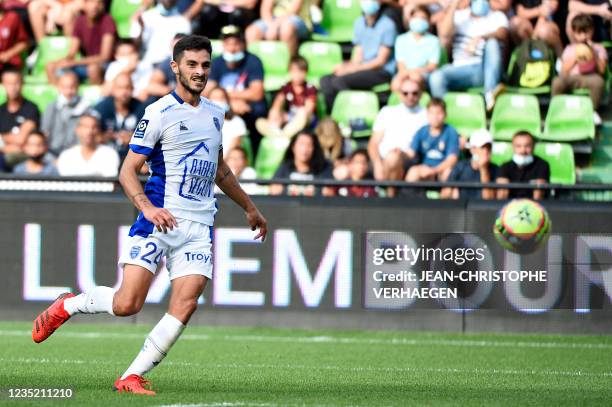 Troyes' midfielder Xavier Chavalerin shoots and scores a goal during the French L1 football match between FC Metz and ES Troyes AC at Stade...