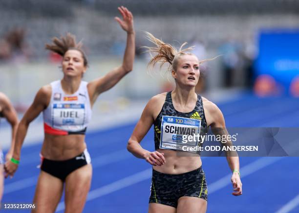 Germany's Corinna Schwab and Norway's Amalie Iuel finish the women's 400m race of the ISTAF international athletics meeting in Berlin on September...