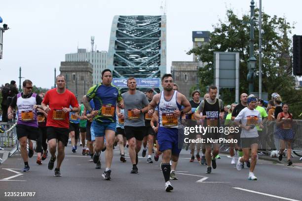 Runners cross the Tyne Bridge during the BUPA Great North Run in Newcastle upon Tyne, England on Sunday 12th September 2021.