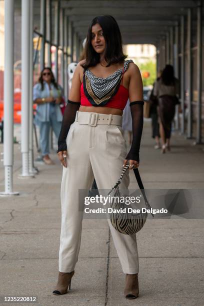 Shaivi Patel is seen wearing a top by H&M, Pants by Zara and a hand bag by Shop Mistry at Spring Studios during New York Fashion Week on September...