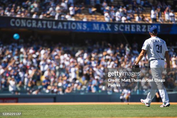 Max Scherzer of the Los Angeles Dodgers walks off the mound after striking out his 3000th batter in the fifth inning at Dodger Stadium on September...