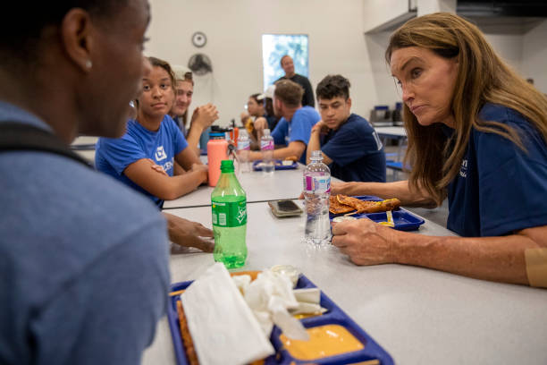 September 11,2021: Republican gubernatorial candidate Caitlyn Jenner, right, talks with young people while touring the Los Angeles Dream Center on...