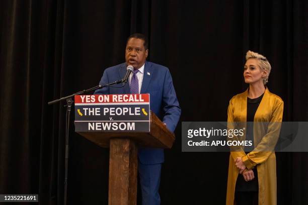 Multimedia artist, writer, thought leader, and sexual assault survivor, Rose McGowan stands next to Conservative talk show host and gubernatorial...