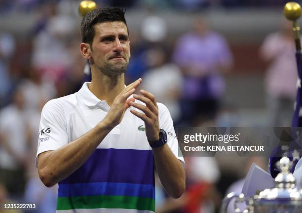 Serbia's Novak Djokovic applauds the crowd after losing to Russia's Daniil Medvedev during their 2021 US Open Tennis tournament men's final match at...