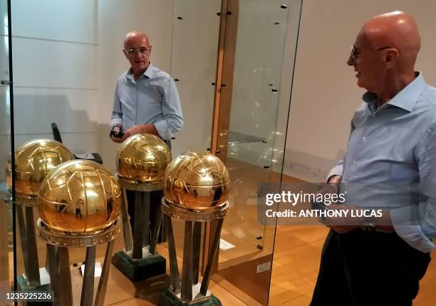 Italian football coach, the former head coach of the Italian national football team and twice manager of AC Milan, Arrigo Sacchi poses in front of...