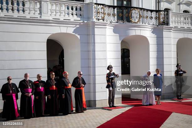 Slovak President Zuzana Caputova and Pope Francis are greeted by an honour guard upon the Pope's arrival at the Presidential Palace on September 13,...