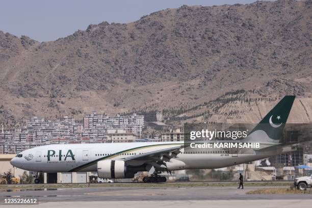 Pakistan International Airlines plane carrying a handful of passengers, which is the first international commercial flight to land since the Taliban...