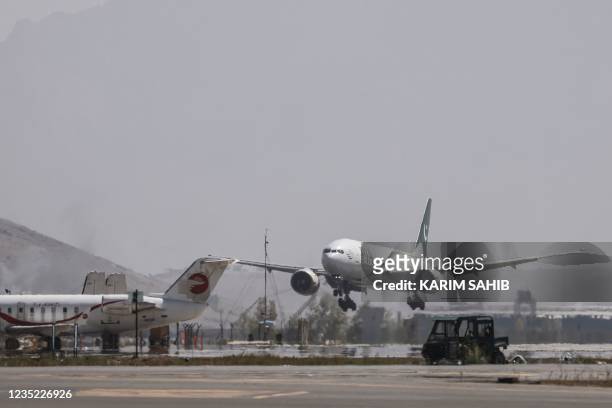 Pakistan International Airlines plane carrying a handful of passengers, which is the first international commercial flight to land since the Taliban...