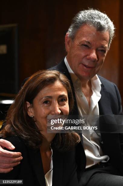 Former Colombian President Juan Manuel Santos and former presidential candidate, French-Colombian Ingrid Betancourt, who was kidnapped by the FARC...