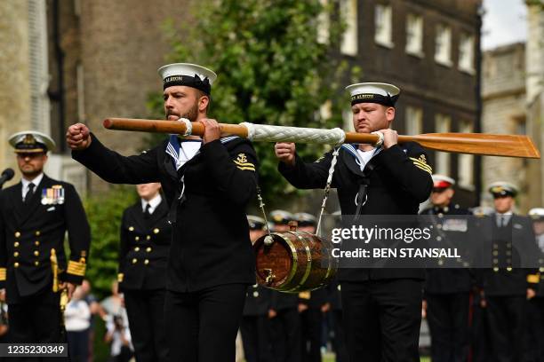 Crew of Britain's HMS Albion carry a keg of wine to the Tower of London during the Constable's Dues ceremony on September 13, 2021 in London. - The...