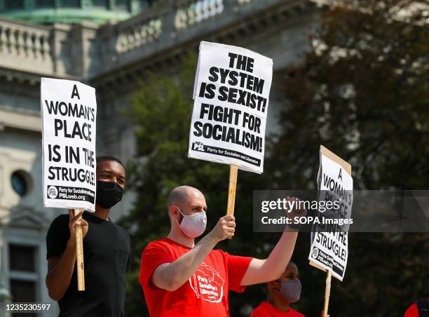 Protesters hold placards in front of the Pennsylvania State Capitol during the Rally for Reproductive Rights. The rally was organized after the...