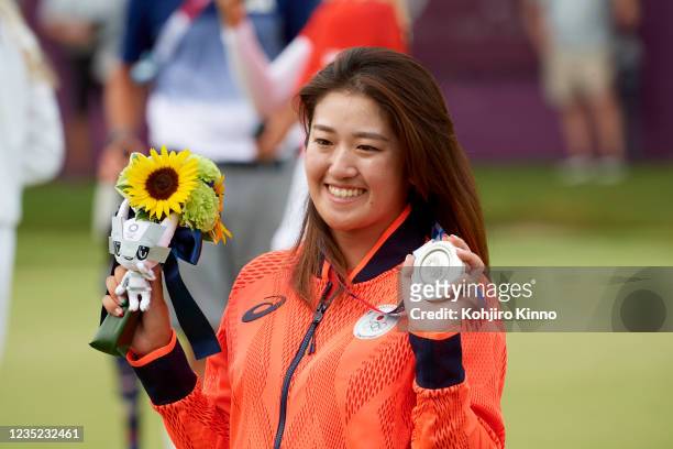 Summer Olympics: Japan Mone Inami victorious, holding up silver medal after Women's Final Round at Kasumigaseki CC. Tokyo, Japan 8/7/2021 CREDIT:...