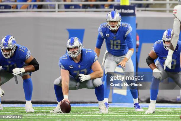 Detroit Lions offensive guard Frank Ragnow and Detroit Lions quarterback David Blough line up before a play during an NFL football game between the...