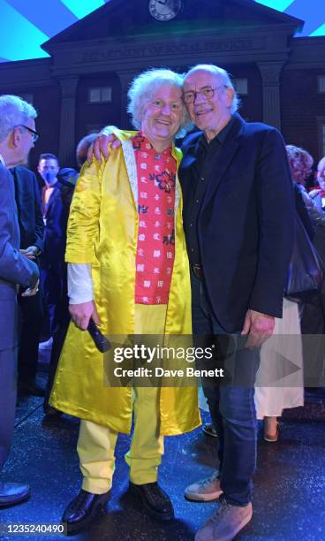 Cast member Mark Oxtoby and Christopher Lloyd bow at the curtain call during the opening night performance of "Back To The Future: The Musical" at...