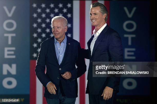 California Governor Gavin Newsom greets US President Joe Biden during a campaign event at Long Beach City Collage in Long Beach, California on...