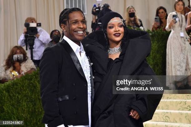 Barbadian singer Rihanna and US rapper A$AP Rocky arrive for the 2021 Met Gala at the Metropolitan Museum of Art on September 13, 2021 in New York. -...