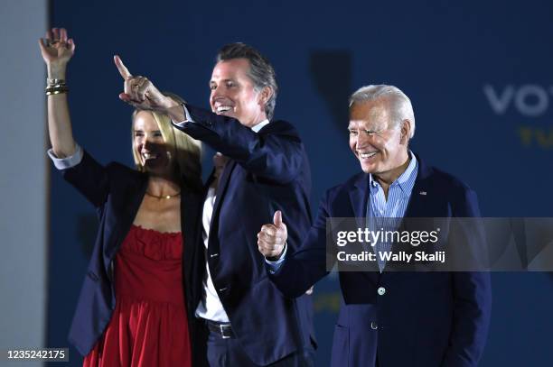 Long Beach, CA U.S. US President Joe Biden waves onstage with California Governor Gavin Newsom and his wife Jennifer Siebel Newsom during a campaign...