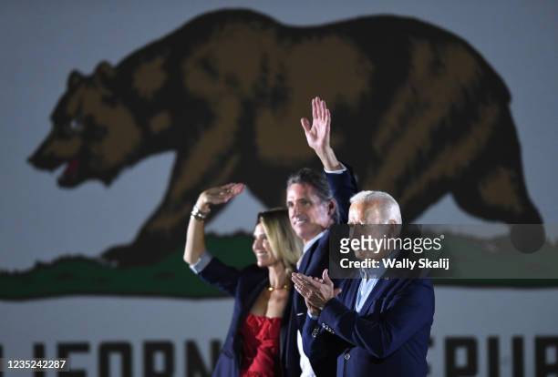 Long Beach, CA U.S. US President Joe Biden waves onstage with California Governor Gavin Newsom and his wife Jennifer Siebel Newsom during a campaign...