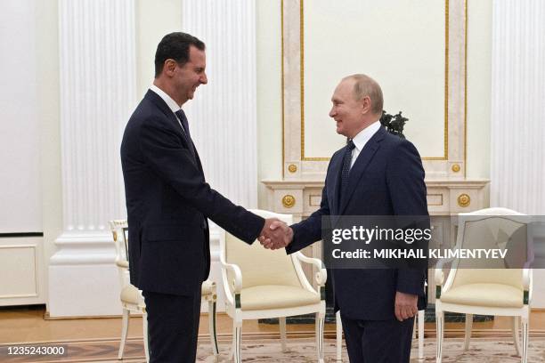 Russian President Vladimir Putin meets with Syrian President Bashar al-Assad at the Kremlin in Moscow on September 13, 2021.
