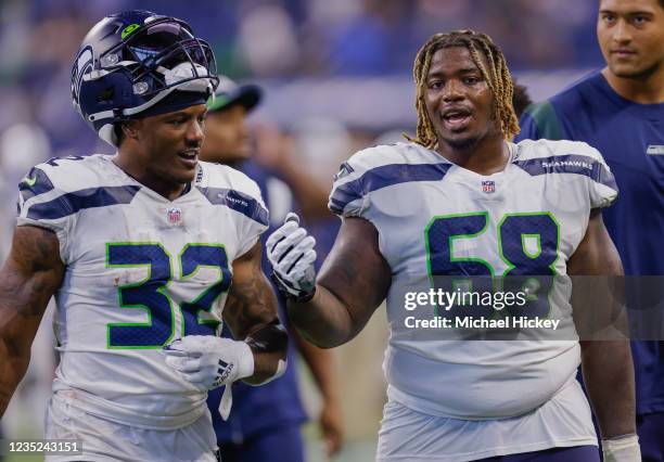 Chris Carson and Damien Lewis of the Seattle Seahawks are seen after the game against the Indianapolis Colts at Lucas Oil Stadium on September 12,...