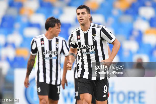 Juventus' forward Alvaro Morata celebrates after scoring the 0-1 goal during the Italian football Serie A match SSC Napoli vs Juventus FC on...