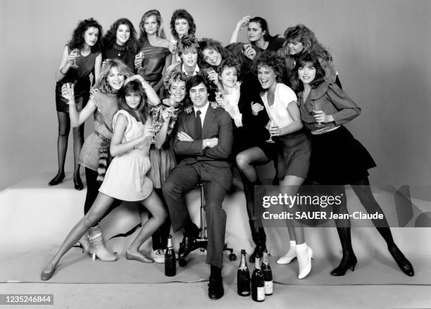 New York, United States, March 29, 1982: The French CEO of the Elite agency John Casablancas with his top models holding glasses of champagne, Kathy...