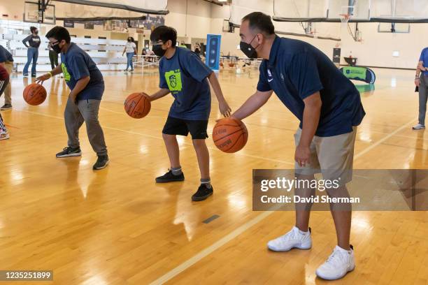 Minnesota Timberwolves President of Basketball Operations Gersson Rosas participates in a Hispanic-youth focused basketball clinic led by the...