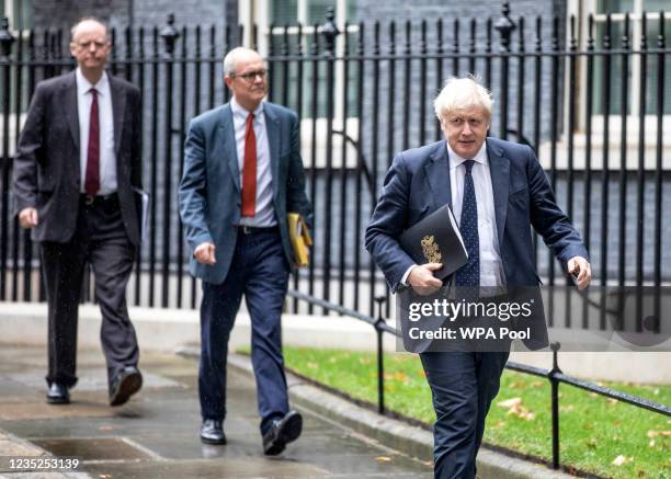 Britain's Chief Medical Officer for England Chris Whitty , Britain's Chief Scientific Adviser Patrick Vallance and Britain's Prime Minister Boris...