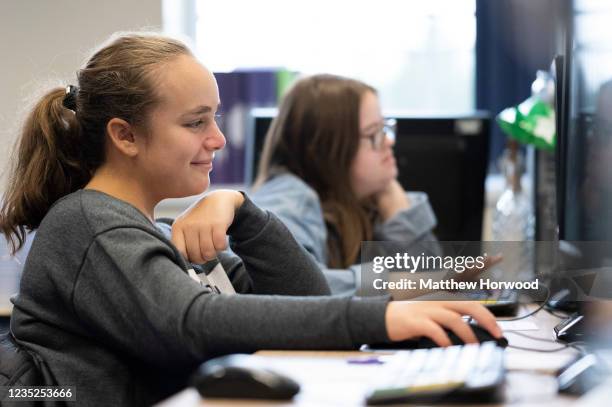 Pupil uses a computer at Whitchurch High School on September 14, 2021 in Cardiff, Wales. All children aged 12 to 15 across the UK will be offered a...