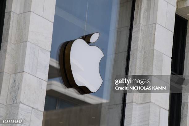 The Apple logo is seen at the entrance of an Apple store in Washington, DC, on September 14, 2021. - Apple users were urged on Tuesday to update...