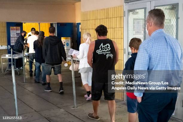 Woodland Hills, CA Voters wait for the polling center to open at El Camino Real high school in Woodland Hills, CA Tuesday, September 14, 2021....