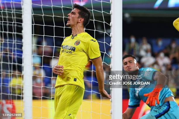 Villarreal's Spanish forward Gerard Moreno reacts to missing a goal opportunity during the UEFA Champions League first round group F football match...