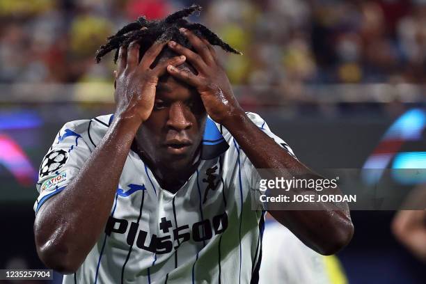Atalanta's Colombian forward Duvan Zapata reacts to missing a goal opportunity during the UEFA Champions League first round group F football match...