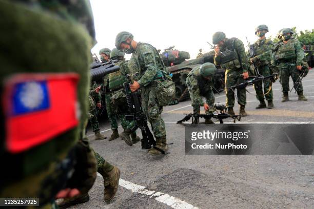Taiwanese soldiers are seen holding grenade launchers and machine guns and driving tanks, during an operation as part of the 37th edition of the...