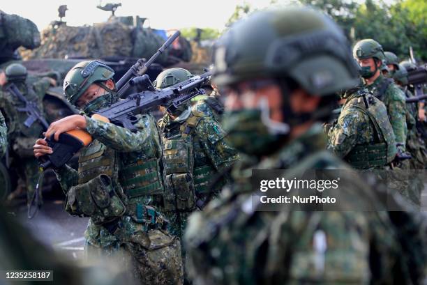 Taiwanese soldiers are seen holding grenade launchers and machine guns and driving tanks, during an operation as part of the 37th edition of the...