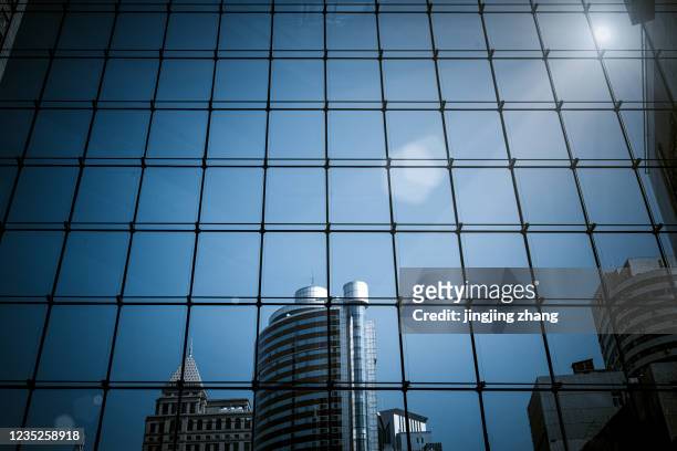 city building, looking up at the glass curtain wall of metal structure high-rise building, xinjiekou, nanjing, china - curtain wall facade stock pictures, royalty-free photos & images