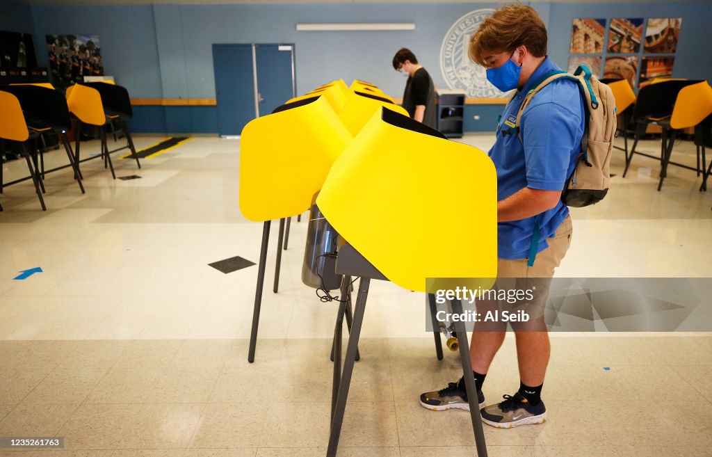 Voters cast their ballots at Santa Monica College as polls open Tuesday morning for Californians to decide whether Gov. Gavin Newsom should be removed from office and, if so, who should replace him in a recall election.