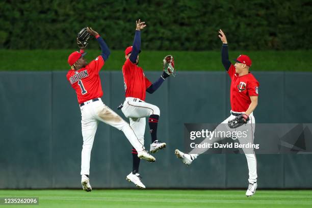 Nick Gordon, Byron Buxton, and Rob Refsnyder of the Minnesota Twins celebrate a 6-3 victory against the Cleveland Indians after game two of a...