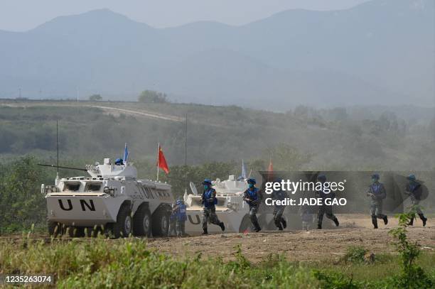 Chinese soldiers take part in the multinational UN peacekeeping live exercise Shared Destiny-2021 held by Chinese military at a tactical training...