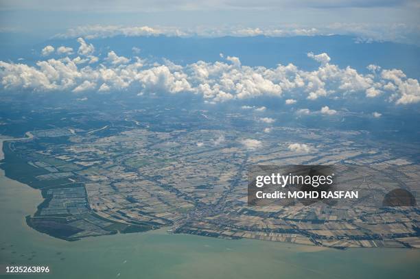 General view shows paddy fields from a Malindo Air plane flying from Subang to Langkawi on September 15, 2021.