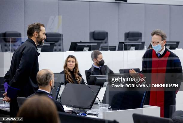 Julius von Bone, lawyer of Salih Mustafa , greets prosecutor Jack Smith at the start of his client, former commander in the Kosovo Liberation Army ,...