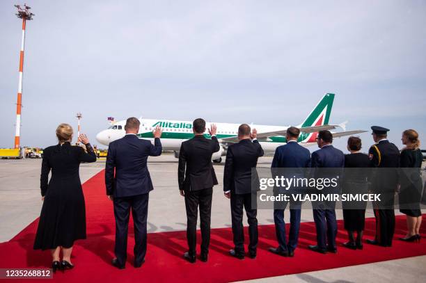 Slovak President Zuzana Caputova and other Slovak political leaders wave as an Alitalia aircraft with Pope Francis on board leaves Bratislava's Milan...