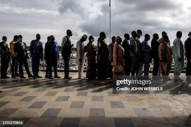 Members of the Guinean Civil Society wait in line at the Peoples Palace ahead of talks with Colonel Mamady Doumbouya in Conakry on September 15,...