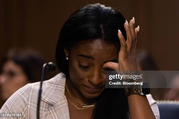 Olympic gymnast Simone Biles reacts during a Senate Judiciary Committee hearing in Washington, D.C., U.S., on Wednesday, Sept. 15, 2021. Senators...