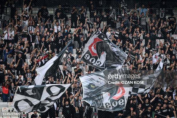 Besiktas supporters cheer their team before the UEFA Champions Leage 1st round Group C football match between Besiktas and Borussia Dortmund in...
