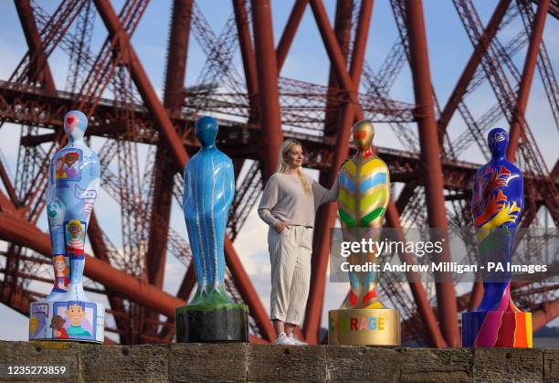 Isy Langhorne stands with some of the sculptures from the art installation Gratitude at The Forth Bridge at North Queensferry, ahead of going on...