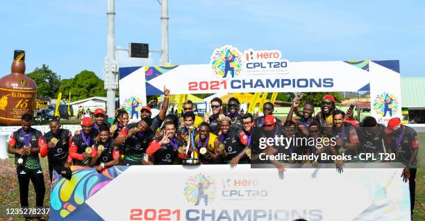 Saint Kitts & Nevis Patriots players pose with the trophy after winning the 2021 Hero Caribbean Premier League Final match 33 between Saint Lucia...