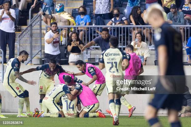 Nicolás Benedetti of Club America celebrates with his teammates in front of Jakob Glesnes of Philadelphia Union after scoring a in the second half of...